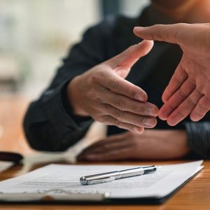 Lawyers shake hands with business people to seal a deal with par Lawyers shake hands with business people to seal a deal with partner lawyers. or a lawyer discussing contract agreements, handshake concepts, agreements, agreements